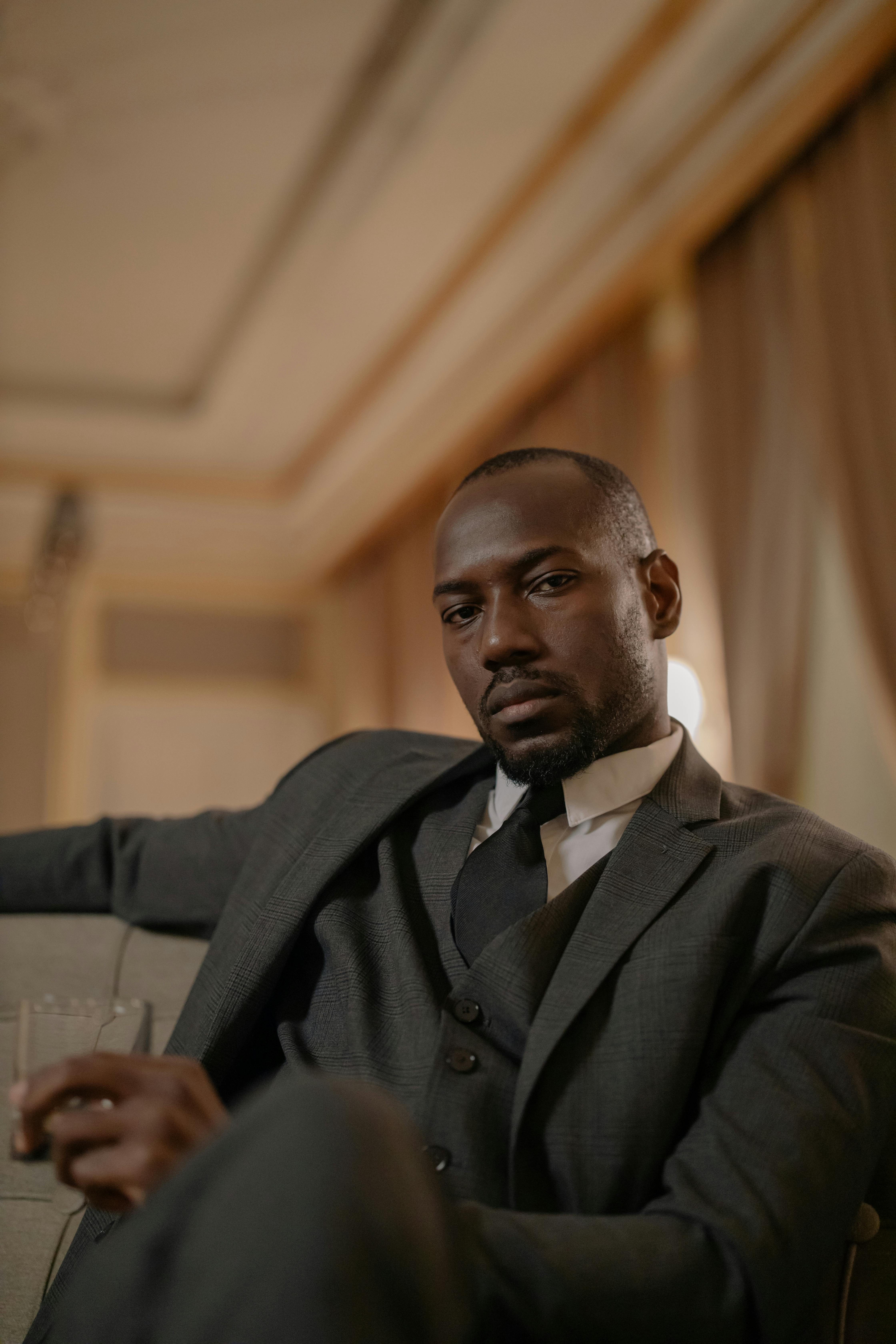 professional photo of 
				man in a suit sitting