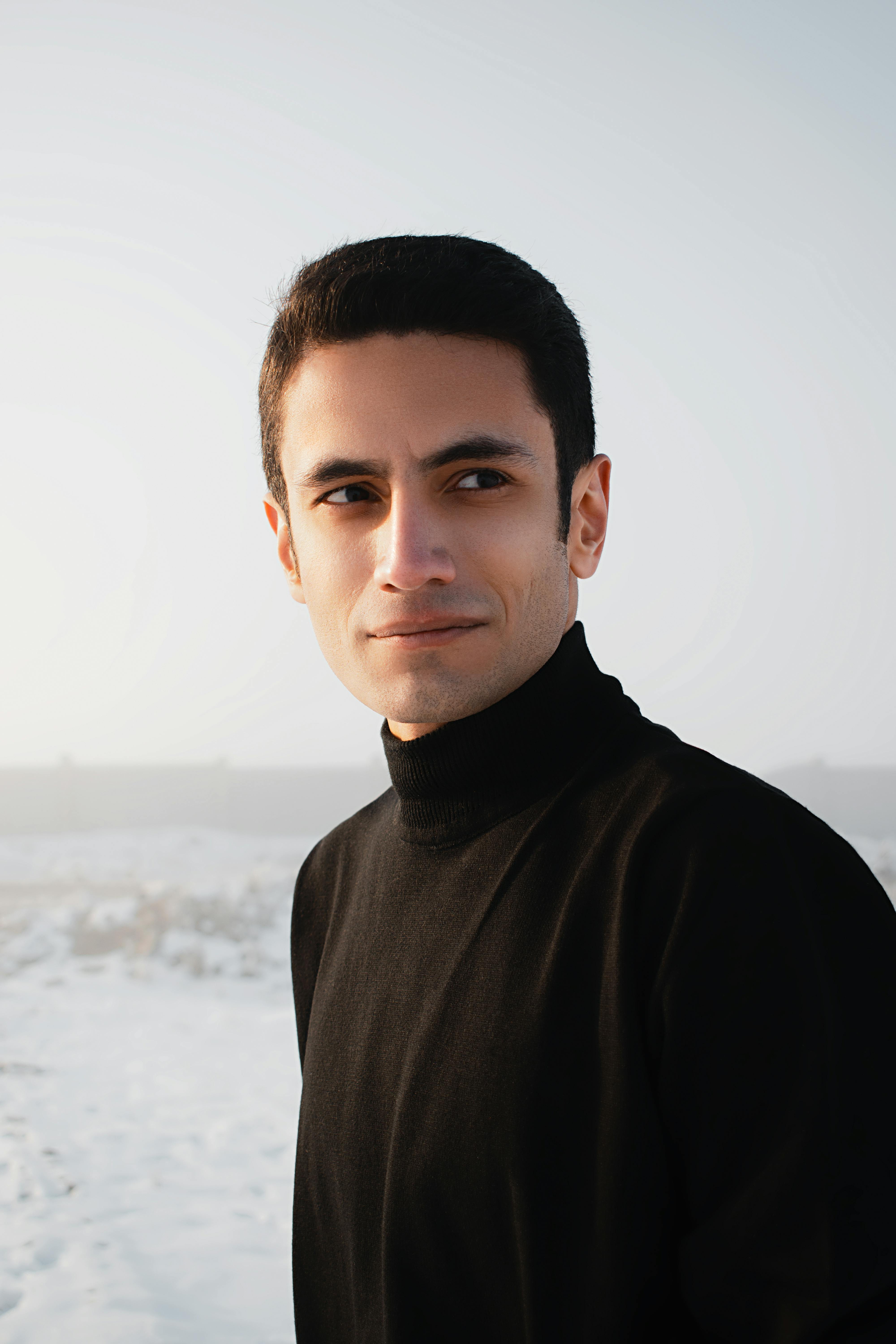 professional photo of 
				man by the beach